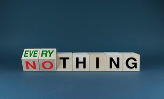 everything or nothing the cubes form the choice words everything or nothing concept of risks and ambitions in business