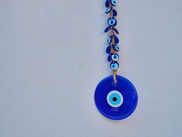 Evil eye bead hanging on the wall