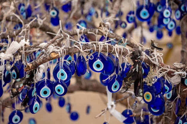 Evil Eye Traditional Turkish amulets hang from a tree