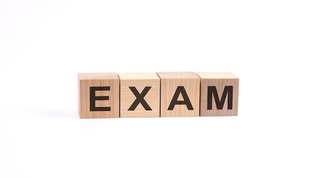 EXAM inscription on wooden cubes isolated on white background