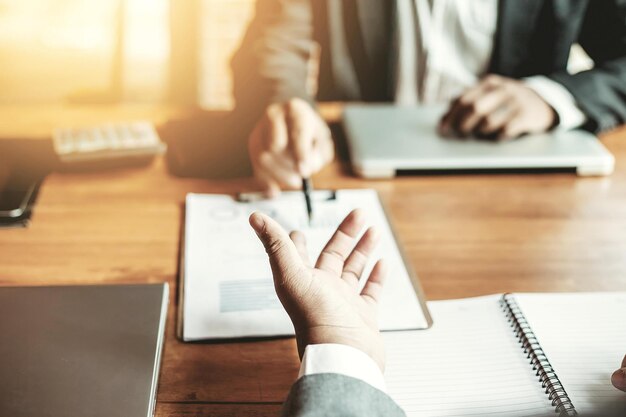 Examiner reading a resume during job interview at office