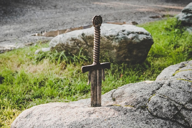 Photo excalibur the famous sword in stone of king arthur legend of king arthur