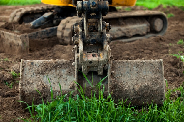 Excavator bucket wide spread land.