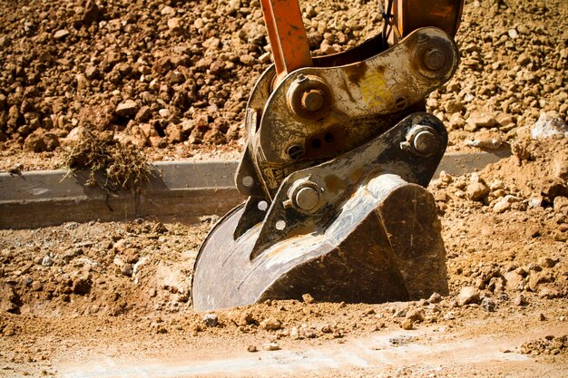 Excavator digging a deep trench