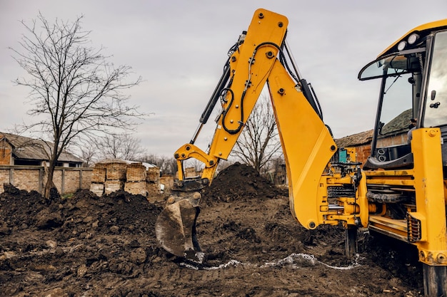 An excavator digging soil on construction site