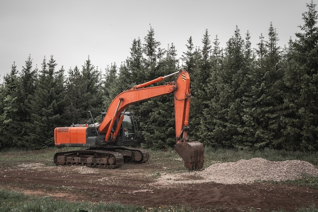 Photo excavator, earth mover at construction site