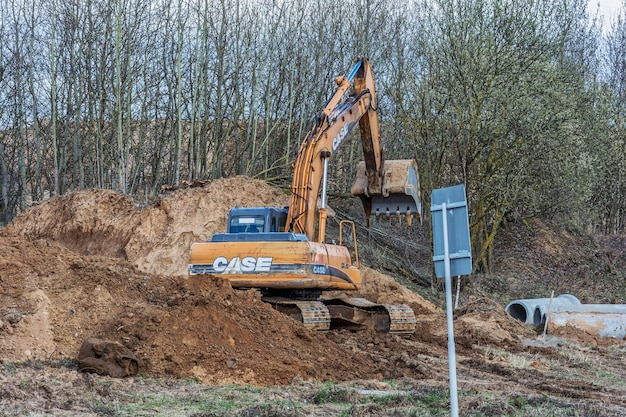 Excavator is digging a trench