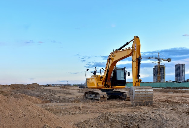 excavator during road work at construction site screeding the gravel