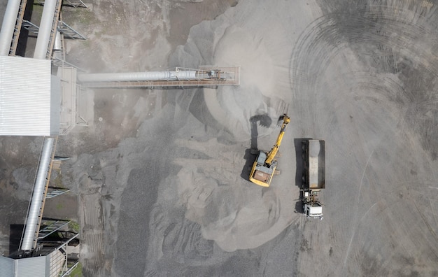 Excavator scooping rocks stone construction