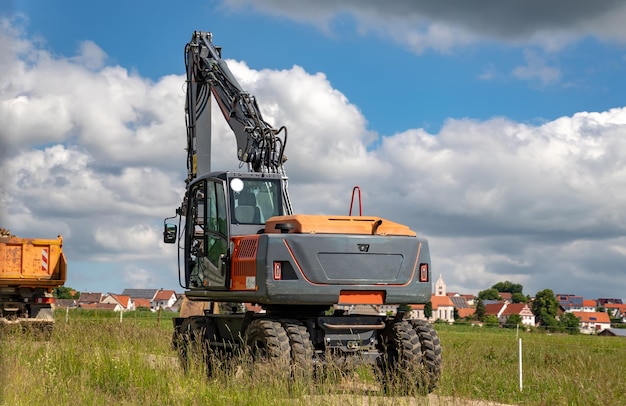 Excavator with a shovel at the road Horizontal view