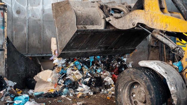 An excavator working at waste sorting plant