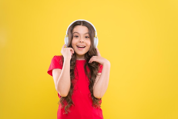 Excellent audio sound quality Child teen enjoy music playing in earphones Little girl enjoying favorite music Catch the rhythm Kid listening music headphones Entertainment and fun Top songs