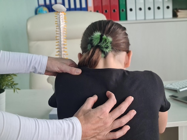 Excellent trained rheumatologist seeing signs of scoliosis concept