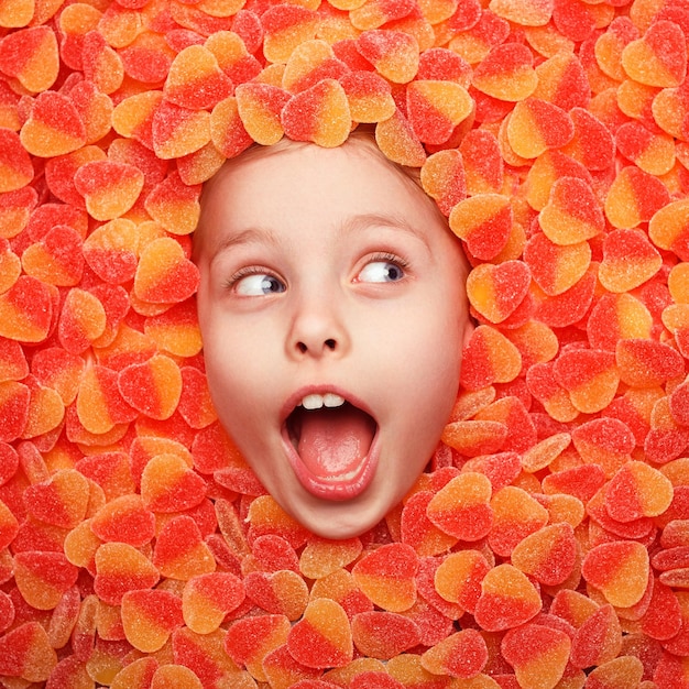 Excite kid posing in fruit jelly