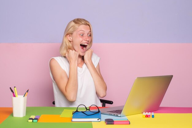 Excited amazed teacher. Teacher in classroom at the school. Girl student or woman teacher portrait.