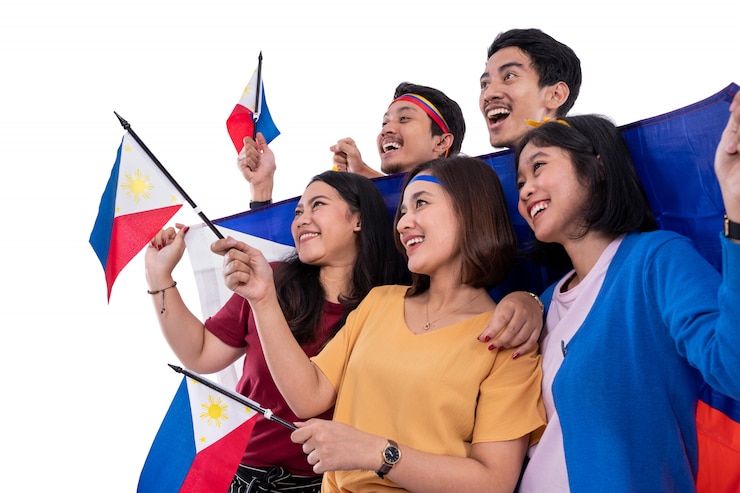 Photo excited asian young supporter holding philippines flag