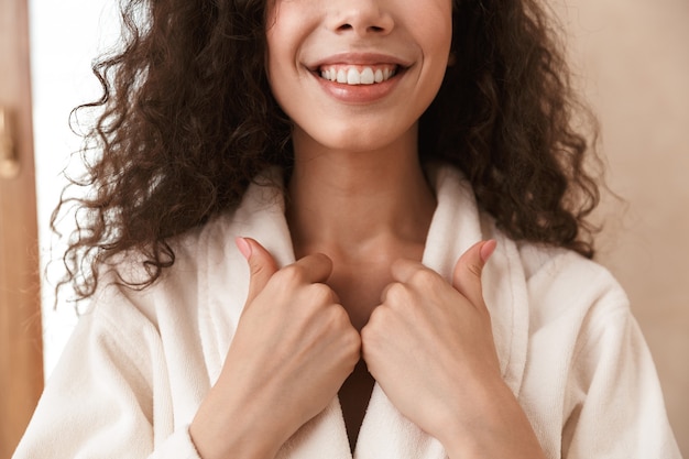 Excited beautiful young cute woman in bathroom.