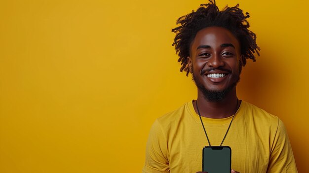 Excited Black Man Showing Smartphone Empty Screen Recommending App Over Yellow Studio Background Smiling To Camera Check This Out Cellphone Display Mockup