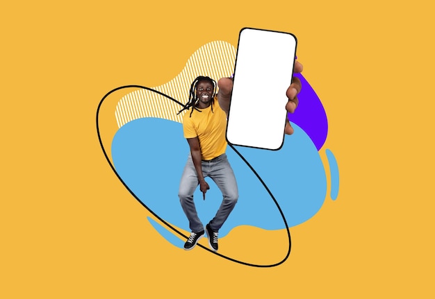 Excited black man with blank smartphone in hand jumping over abstract background