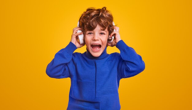 Excited boy listening to music