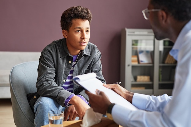 Excited Boy Talking to Psychologist