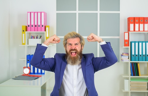 Excited businessman in office leadership ceo business expert businessman emotional victory excited