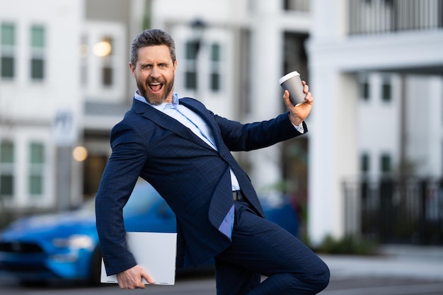 Excited businessman walking in city funny business man walk on city street business man walking outd