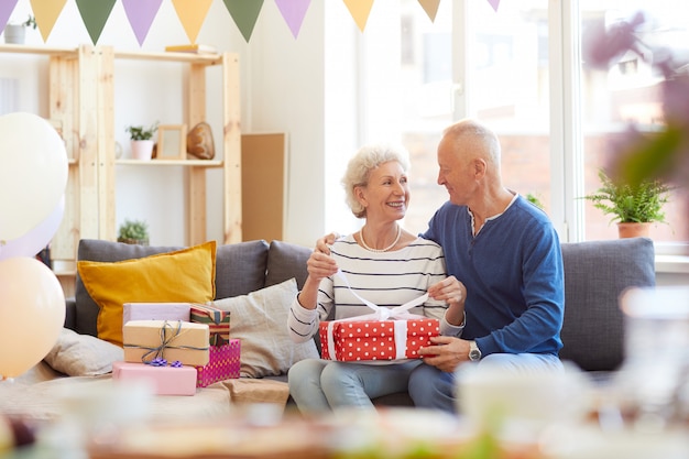 Excited couple opening presents