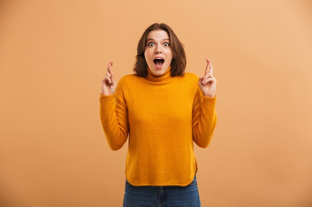 Excited emotional young woman.