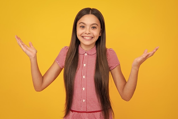 Excited face Portrait of joyful child girl with raised hands Caucasian teenager screaming isolated