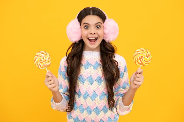 Excited face Teenager girl with caramel candies on sticks sweet sugar addiction Child with lollipops Amazed expression cheerful and glad