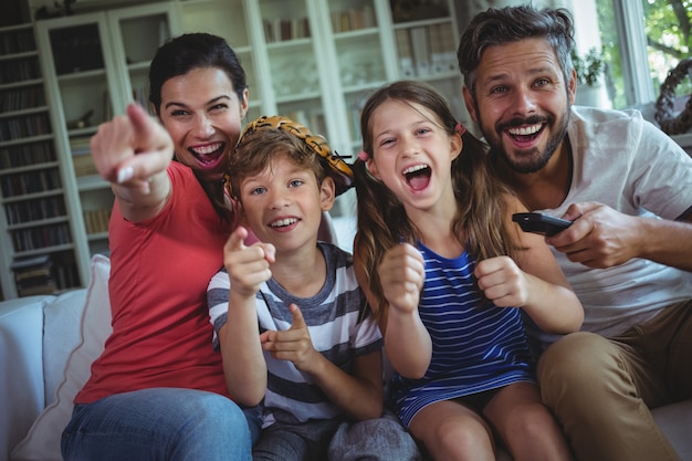 Excited family watching television