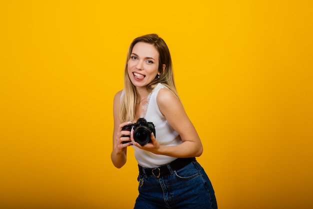 Excited female photographer working in studio.