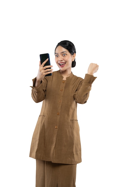 Excited female teacher in civil servant uniform with clenched hands