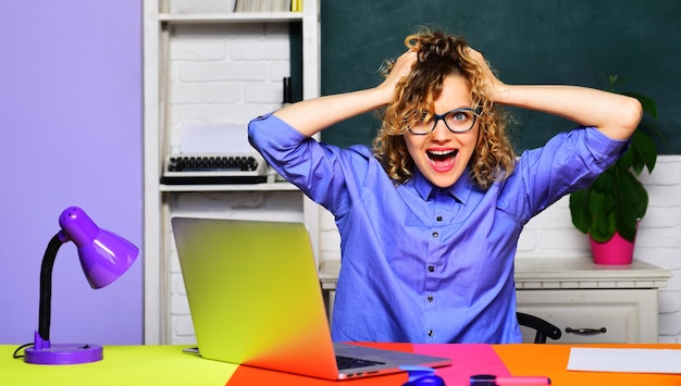 Photo excited female teacher or university professor at workplace teachers day university student working