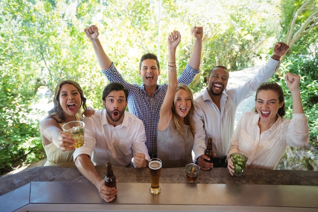 Excited friends at counter