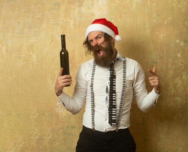 Excited fun drunk santa drunk hipster man bad santa claus new\
year christmas mood