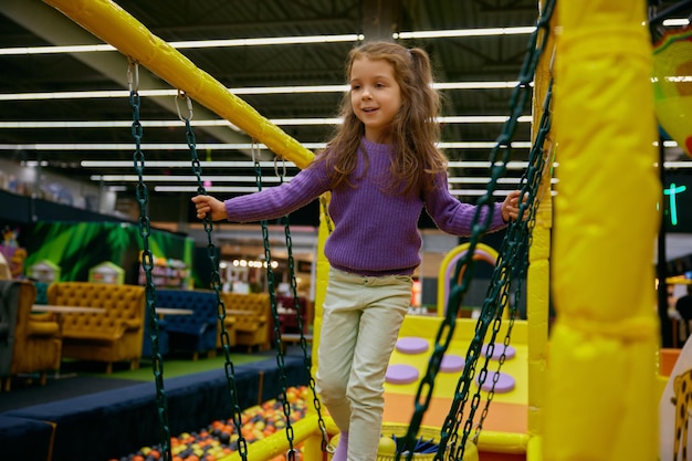 excited girl child at indoor playground