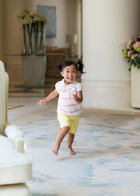 Excited girl playing at home