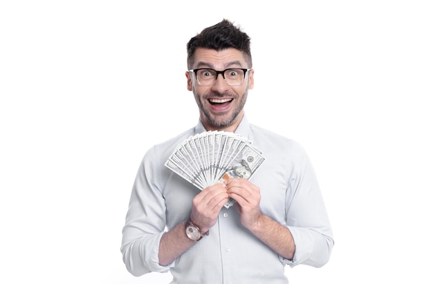 Excited guy holding paper money studio Rich guy smiling with money banknotes Personal loans Cash money for lending Making and spending money