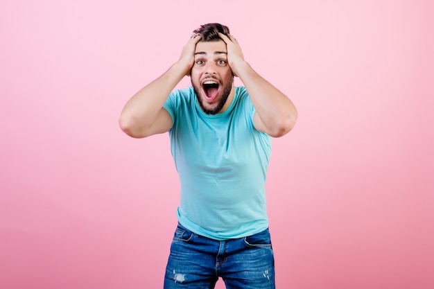 Excited happy guy holding his head