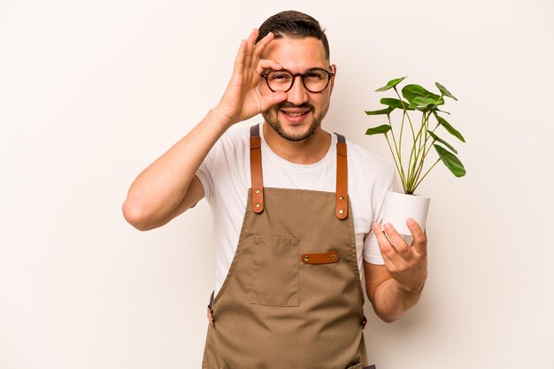 Excited keeping ok gesture on eye