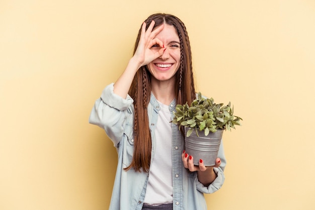 Excited keeping ok gesture on eye