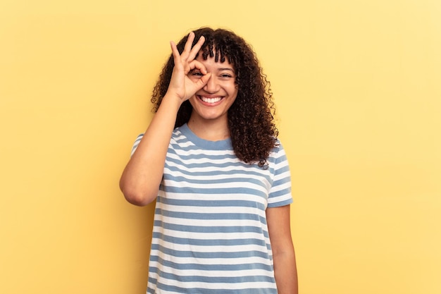 Excited keeping ok gesture on eye