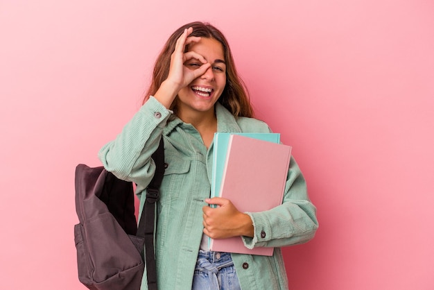 Excited keeping ok gesture on eye