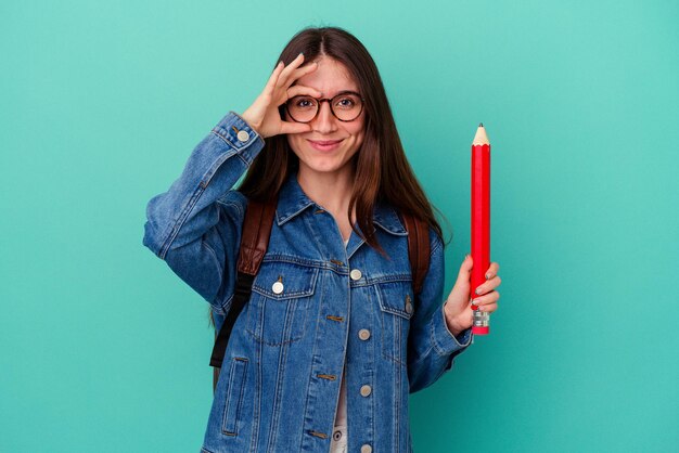 Excited keeping ok gesture on eye