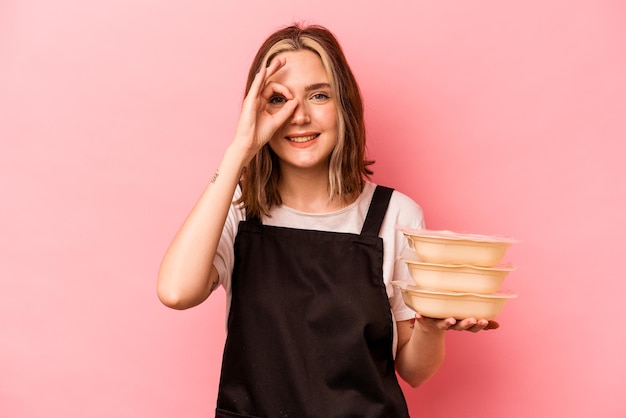 Excited keeping ok gesture on eye