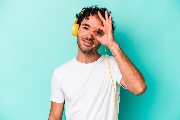 Photo excited keeping ok gesture on eye