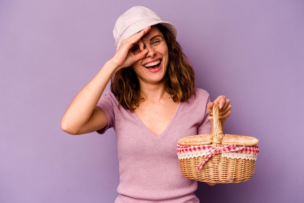 Excited keeping ok gesture on eye