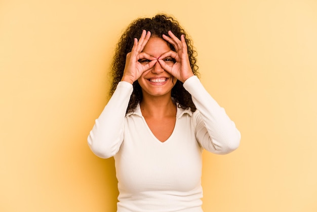 Excited keeping ok gesture on eye